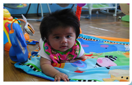 Child crawling on Mat